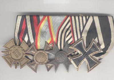 Mounted for wear on great coat with wide lapels with the highest ranking medal, Iron Cross, at the top